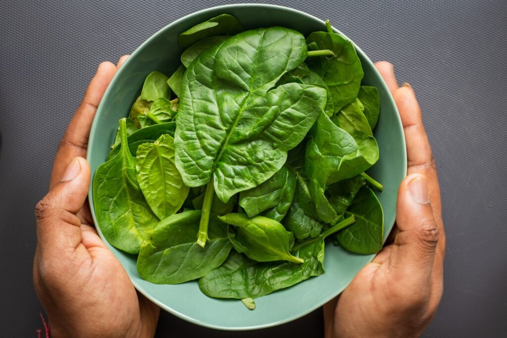 Fresh leafy greens illustrating spinach and vegetable choices.